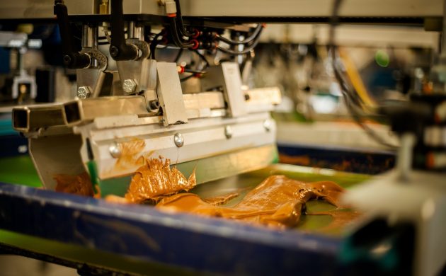 Screen print machine spreading ink on frame Screen print machine spreading ink on frame